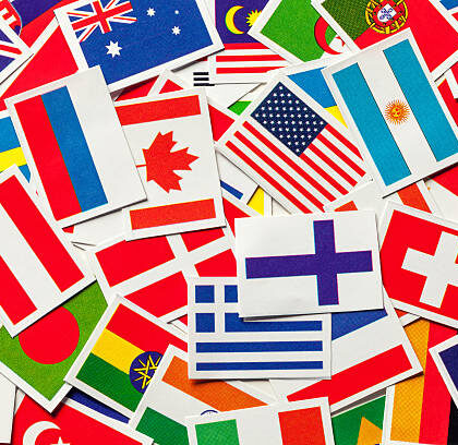 National flags of the different countries of the world in a heap. Top view National flags of the different countries of the world in a heap. Top view